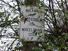 Image showing a street sign stating walkway not accessible for wheelchair use.